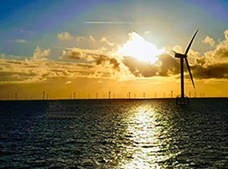 windfarm sunset over sea